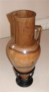 Walnut jug in an ebonised stand by Pat Hughes